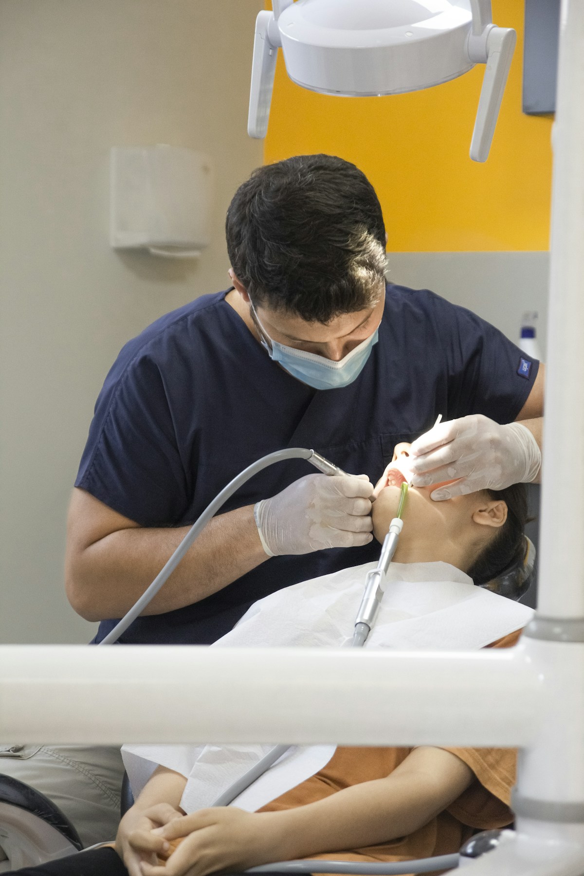 Dentist providing preventive dental treatment to a patient